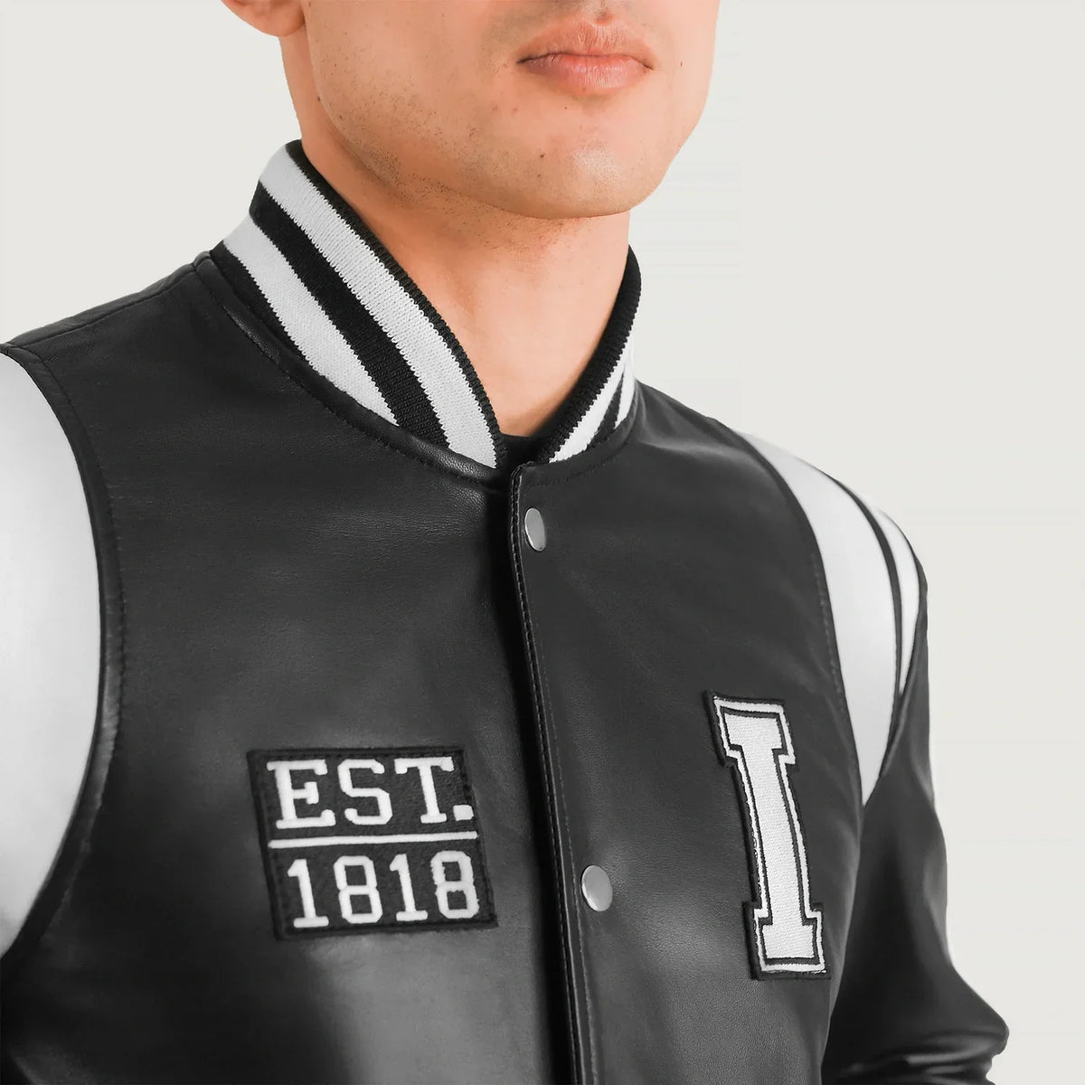 Close-Up Detail of Varsity & Snap Button Hardware on Liberte Illinois Black Leather Varsity Jacket