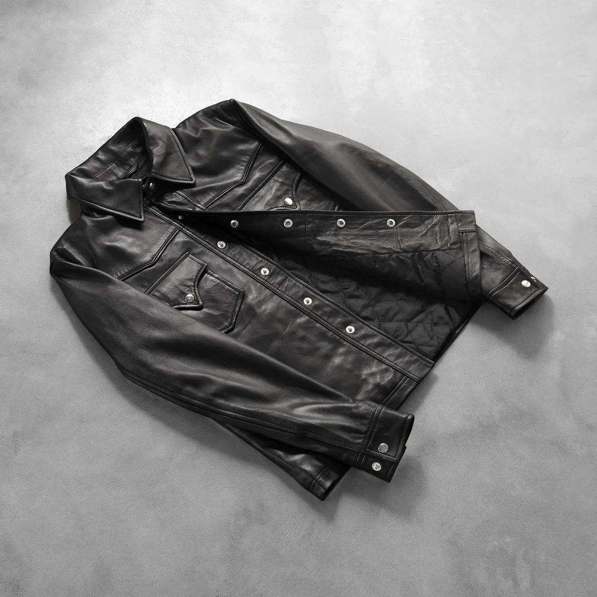 Button & Hem Craftsmanship Construction Detail on Men's Ranchson Black Leather Shirt