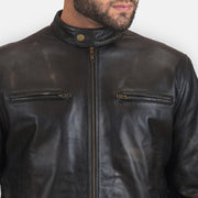 Close-Up Detail of Band with snap button & Zipper Hardware on Rustic Black Leather Biker Jacket