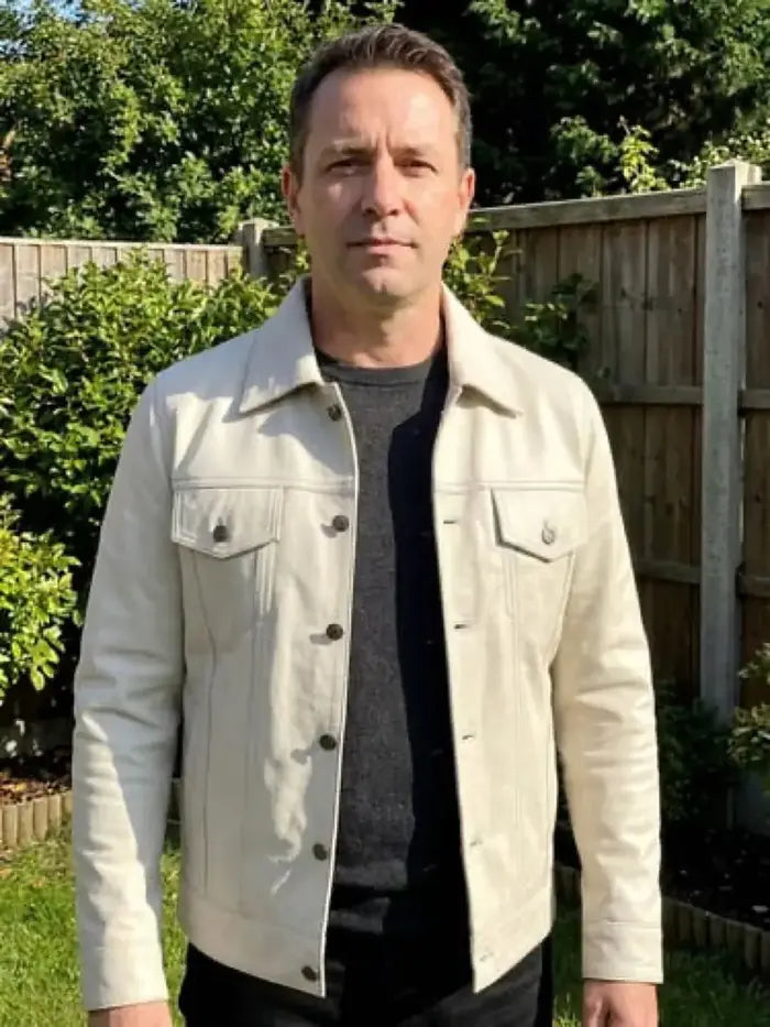 Verified client Julian Thorne (London, UK) wearing the Orlaven Fernando Men’s Off White Leather Trucker Jacket in off-white cream 100% full-grain cowhide leather, featuring clean tailored shoulder drape and heavy brass hardware.
