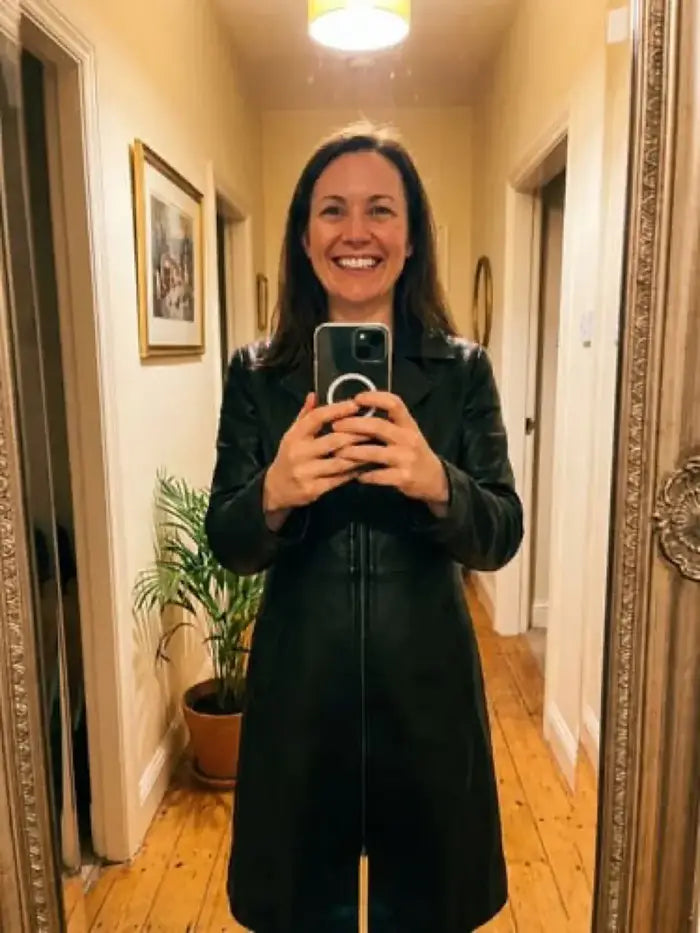 Verified client David Sterling (Zurich, CH) wearing the Orlaven Women’s Black Leather Car Coat in deep onyx black supple full-grain lambskin leather, highlighting the structured collar, precision topstitching, and slim silhouette.