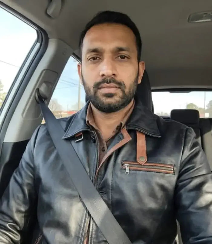 Verified client Samuel Davies (Melbourne, AU) wearing the Orlaven Men’s Black Leather Overcoat — Mid-Length Car Coat Style in deep onyx black tailored full-grain calfskin leather, showcasing tailored shoulder seams, heavy brass hardware, and rich natural leather patina in Melbourne.