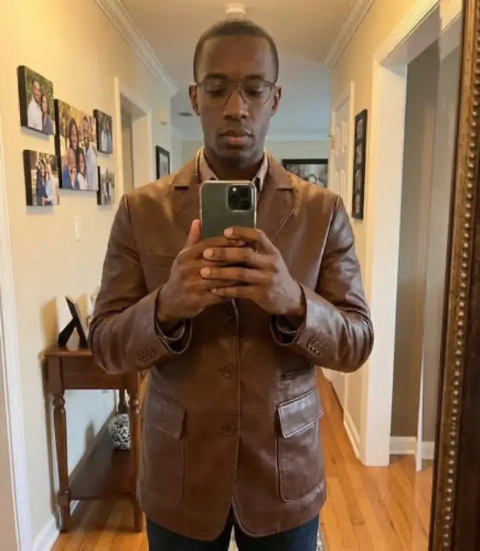 Verified client Kalle Roosileht (Tallinn, EE) wearing the Orlaven Eliseo Men’s Cognac Three Button Leather Blazer in cognac brown tailored full-grain calfskin leather, showcasing tailored shoulder seams, heavy brass hardware, and rich natural leather patina in Tallinn.