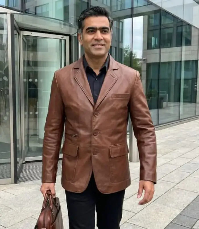 Verified client Lucas Moreau (Paris, FR) wearing the Orlaven Eliseo Men’s Cognac Three Button Leather Blazer in cognac brown tailored full-grain calfskin leather, paired with tailored wool trousers and leather footwear in Paris.