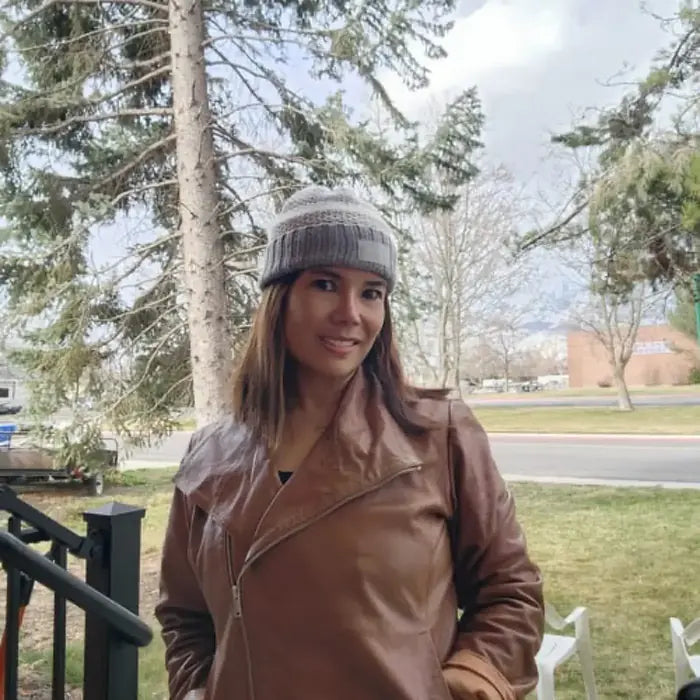 Verified client Lukas Bauer (Vienna, AT) wearing the Orlaven Virgin River Melinda Monroe Suede Biker Jacket in rich cognac brown full-grain calfskin suede, displaying authentic leather patina and rugged asymmetrical moto styling.